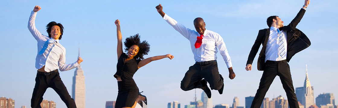 Young people in business attire jumping